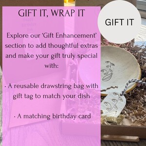 May include: A gift box with a ceramic dish, gift tag, and a matching birthday card. The dish has a floral design. The text "GIFT IT, WRAP IT" and "GIFT IT" are visible. The box includes a reusable drawstring bag.
