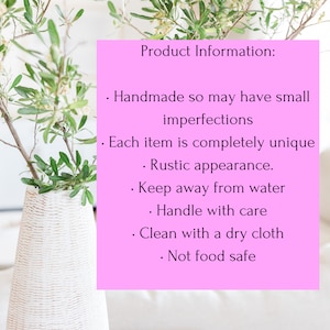 May include: A bright pink rectangular sign with black text that reads: Product Information: Handmade so may have small imperfections, Each item is completely unique, Rustic appearance, Keep away from water, Handle with care, Clean with a dry cloth, Not food safe.