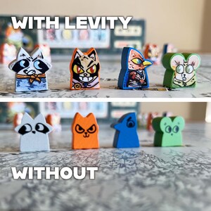 May include: Two rows of painted animal figurines, showing the difference between the figurines with and without a glossy finish. The top row shows the figurines with a glossy finish, while the bottom row shows the figurines without a glossy finish. The figurines are all different animals, including a raccoon, a cat, a bird, and a mouse.