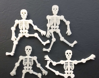 Conjunto de 4 esqueletos con brazos y piernas móviles