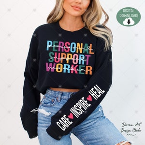 May include: Black cropped sweatshirt with the text "PERSONAL SUPPORT WORKER" in rainbow colors on the front and the text "CARE INSPIRE HEAL" with hearts on the sleeve.