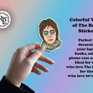 May include: A colorful sticker featuring a cartoon illustration of John Lennon with the word "Imagine" written in a psychedelic font around his neck.