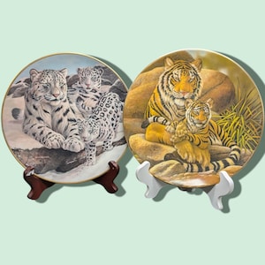 1980 Gene dieckhoner vanishing animals, collector plates, the Asian monarch and the snow leopards