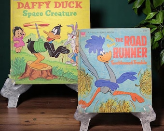 Vintage tellatale books featuring Daffy, duck and the roadrunner
