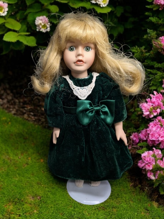 Vintage the collector's choice series by dandy porcelain doll with green  velvet dress 12 in