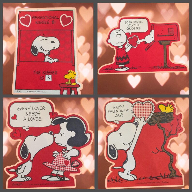 May include: Four vintage Valentine's Day cards featuring the Peanuts characters. The cards are red with white hearts and feature Snoopy, Woodstock, and Lucy. The text on the cards reads "Sensational Kisses $1", "Born Losers Can't Be Choosers", "The Kisser Is In", "Every Lover Needs A Lovee!" and "Happy Valentine's Day!"