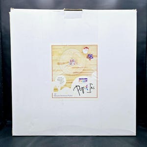 May include: A white cardboard box with a product image of a clear, circular sectional platter. The platter has three sections and is decorated with patriotic-themed images. The box also features the text "Pop & Ins" and "14" Circular Sectional Platter."