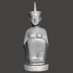 May include: A gray, seated statue of a person wearing a tall, pointed hat. The statue is made of a smooth, textured material and has a detailed face.