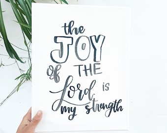 Segno calligrafico con versetto della Bibbia scritto a mano
