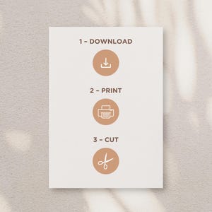May include: A white card with brown text and icons outlining the steps to download, print, and cut a printable design. The text reads "1 - Download", "2 - Print", and "3 - Cut".
