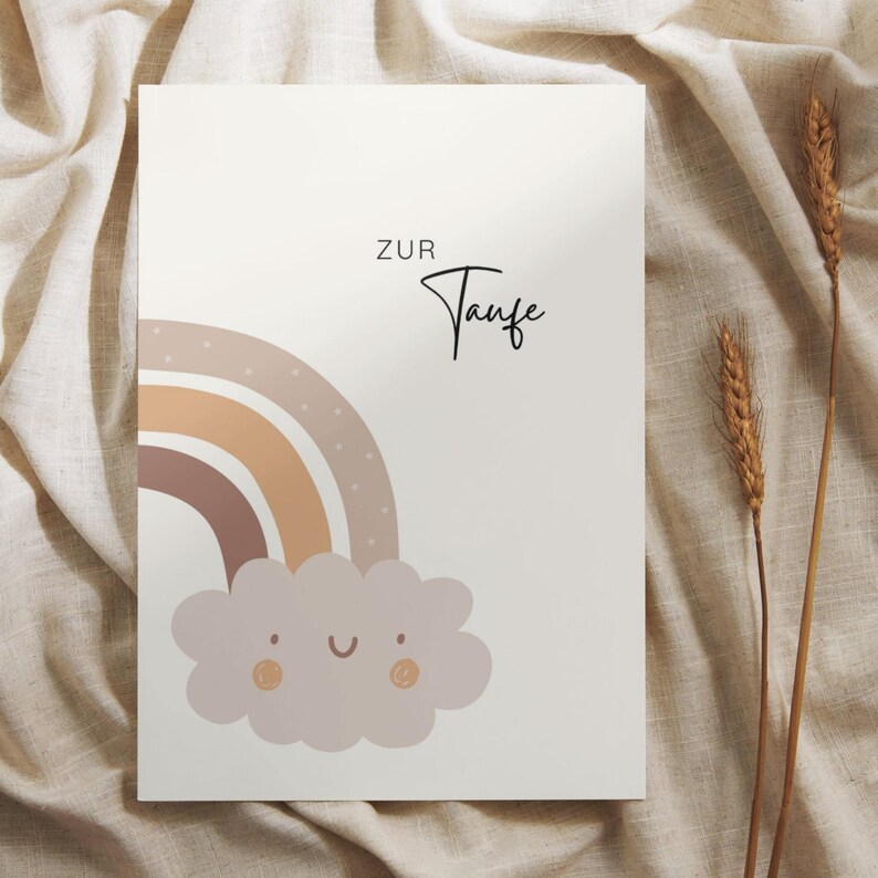 May include: A white card with a rainbow and a cloud with a smiley face. The text "Zur Taufe" is printed on the card.