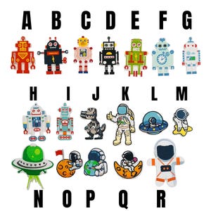 May include: A collection of embroidered patches labelled A through R, featuring various robots, astronauts, a dinosaur, and UFOs. The designs include colourful characters in space-themed motifs, each with distinct details like antennas, helmets, and planets.