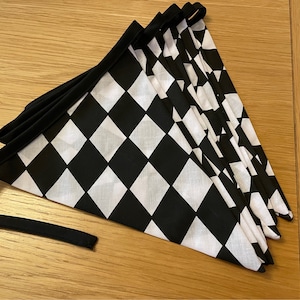 Racing car checkered flag children’s room or nursery bunting matching book cushion available from Etsy shop