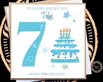 May include: A blue and white birthday card with the number 7 and a birthday cake with candles. The card says "To a very special son Toby Happy 7th Birthday".
