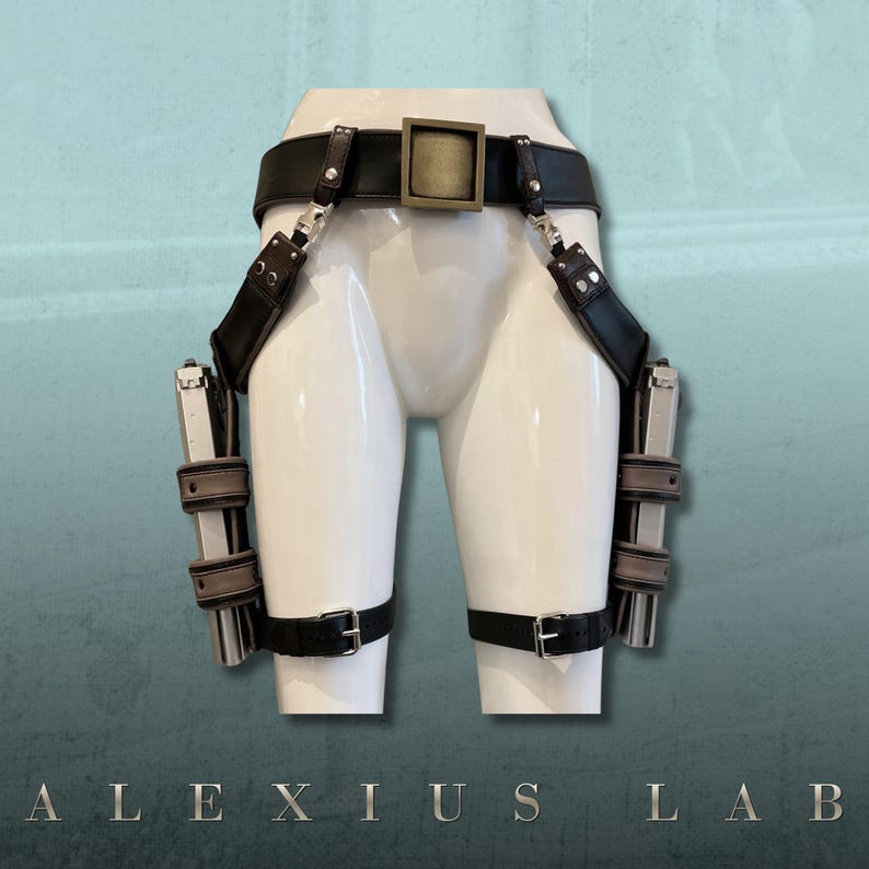 May include: Black leather gun holster with two silver-colored pistols. The holster includes a belt, shoulder straps, and leg straps with silver-colored hardware. The text "ALEXIUS LAB" is at the bottom.