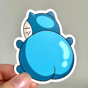 May include: A blue and white cartoon sticker of a character with a large, round body and a small head. The character is facing away from the viewer and has a small smile on its face. The sticker is signed "riche.ryumi".