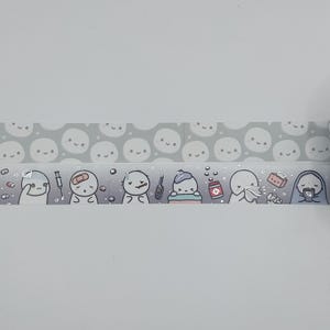 May include: Washi tape with a repeating pattern of smiling faces and illustrated characters experiencing various illnesses. The characters are depicted with bandages, thermometers, and medicine, in a cute, cartoon style.