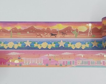 May include: Three strips of washi tape with different designs. The top strip features a sunset scene with horses running across a desert landscape. The middle strip has a gold star and floral pattern. The bottom strip shows a pink and orange desert scene with a pink dinosaur, a building, and a pool.