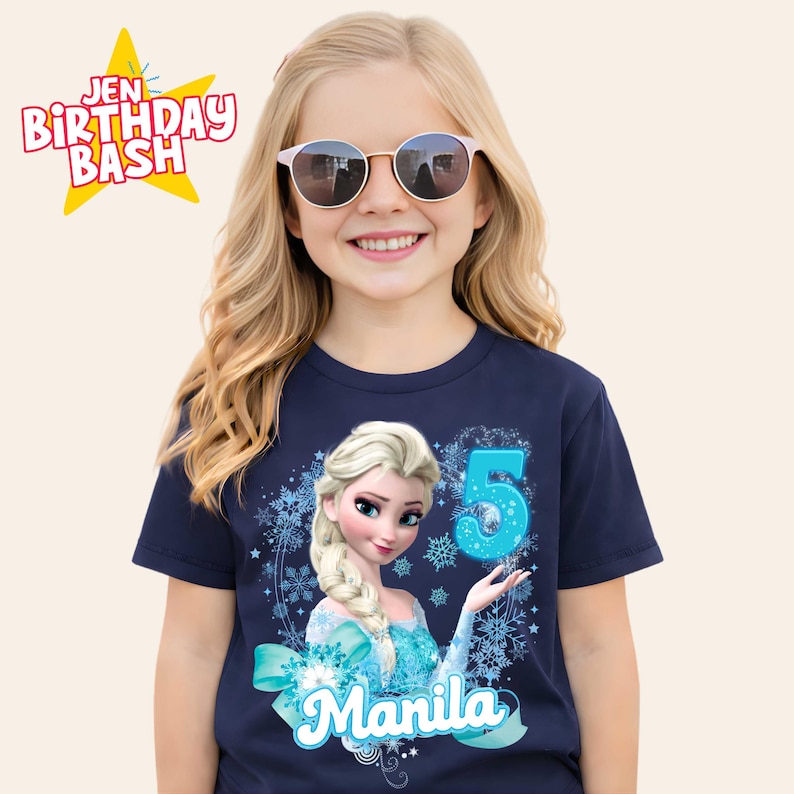 May include: Navy blue t-shirt featuring a graphic of Elsa from Frozen, the number 5, and the name "Manila". The shirt also has the text "Jen Birthday Bash" in a starburst design.