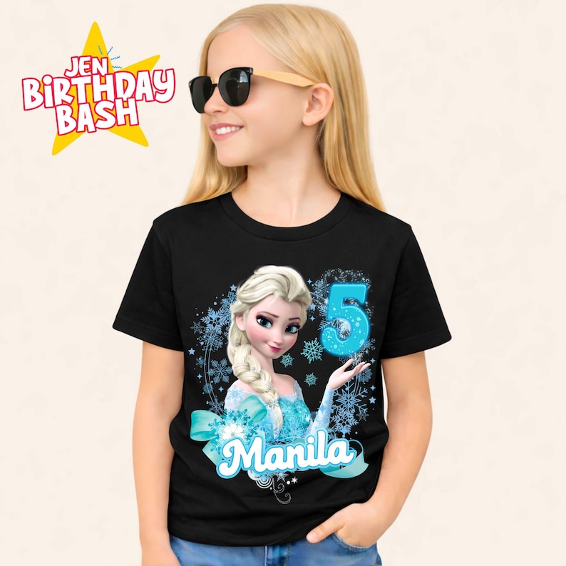 May include: Black t-shirt featuring a cartoon image of Elsa from Frozen, with the number 5 and the name "Manila" in a blue font. The shirt also has the text "Jen Birthday Bash" in a yellow star.