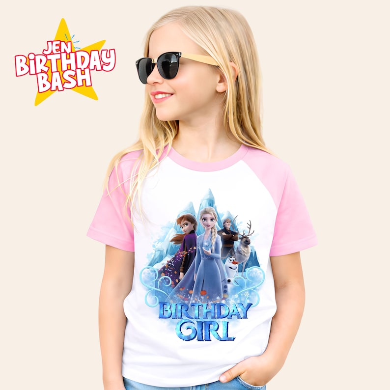 May include: A white and pink raglan t-shirt featuring characters from the movie Frozen. The shirt has a graphic of Elsa, Anna, Kristoff, Sven, and Olaf with the words "Birthday Girl" in blue. The text "Jen Birthday Bash" is in a yellow star.