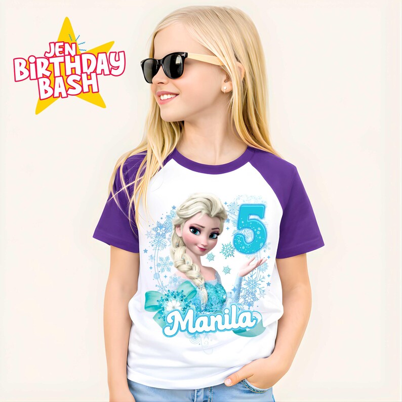 May include: White and purple raglan t-shirt featuring a cartoon image of Elsa from Frozen, the number 5, and the name "Manila". The shirt also has the text "Jen Birthday Bash" in a star-shaped design.
