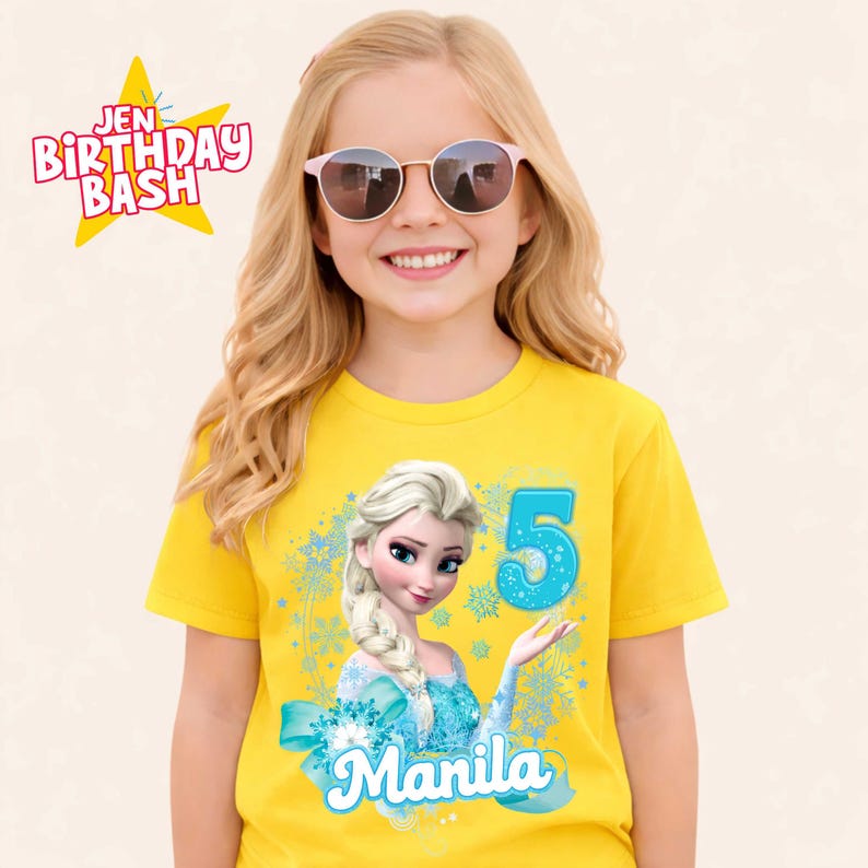 May include: A yellow t-shirt featuring a graphic of a cartoon character and the number 5 in turquoise. The text "Manila" is below the graphic. The shirt also has the text "Jen Birthday Bash" in a star.