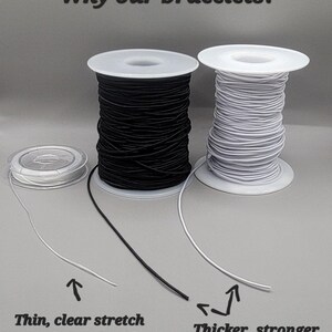 May include: Two spools of elastic cord for making bracelets. The left spool has thin, clear elastic cord. The right spool has thicker, white elastic cord. The text "Why our bracelets?" is at the top of the image. The text "Thin, clear stretch cord most people use" is below the left spool. The text "Thicker, stronger stretch cords we use" is below the right spool.