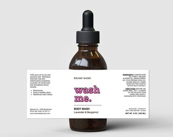 May include: A brown glass bottle with a dropper top, labeled "wash me."  The bottle contains body wash with lavender and bergamot scents. The label also lists the ingredients and directions for use.  The bottle is 8 oz (240 ml).