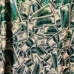 Money design with green foil 4-way nylon spandex sold by the yard