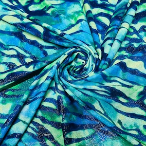 New Avatar pattern design print on the best quality of nylon spandex with foil 4-way stretch 58/60”sold by the YD.Ships worldwide from LA