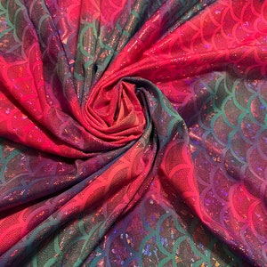 Tie dye mermaid scale design print on nylon spandex with hologram foil 4-way stretch 58/60”sold by the YD.Ships worldwide from Los Angeles