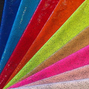 New Hologram Metallic pebbles design print on nylon spandex 4-way stretch 58/60”Sold by the YD.Ships worldwide from Los Angeles California