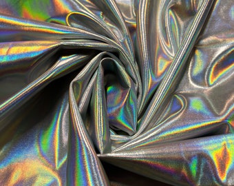 New iridescent/silver all over foil nylon spandex 4-way stretch 58/60”sold by the YD. Ships worldwide from Los Angeles California USA.