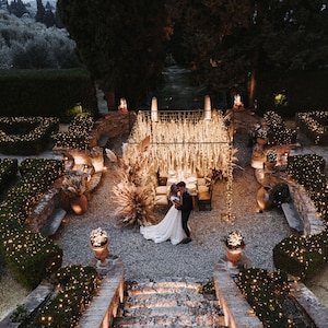 3’ lights and pampas grass used in canopy over wedding tables