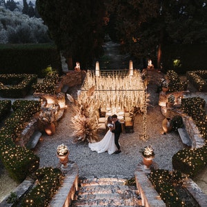 3’ lights and pampas grass used in canopy over wedding tables