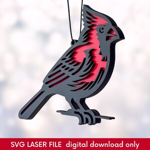 side view of laser cut Christmas ornament of a red cardinal