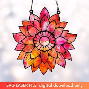 May include: A laser cut mandala design with a pink and orange color scheme. The mandala is intricate and detailed, with a floral pattern. The mandala is perfect for adding a touch of bohemian style to your home decor.