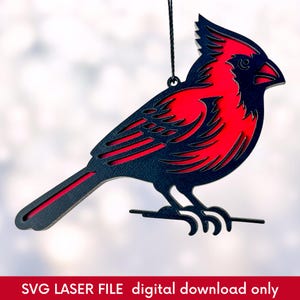 laser cut Christmas ornament of a red cardinal