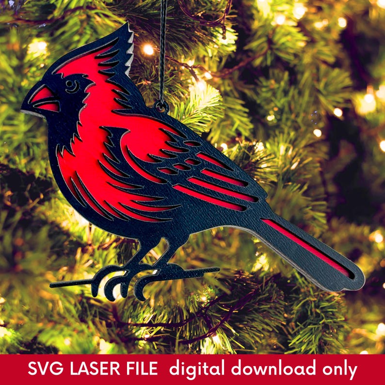 laser cut Christmas ornament of a red cardinal hanging from a Christmas tree