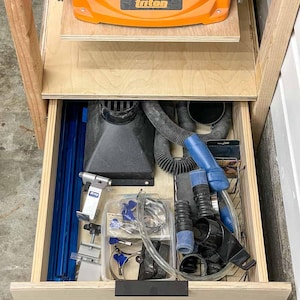 workshop tool stand with drawer open to show storage
