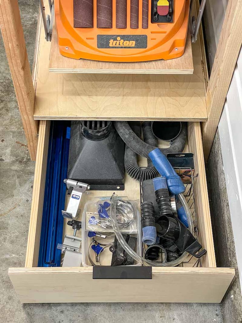 workshop tool stand with drawer open to show storage