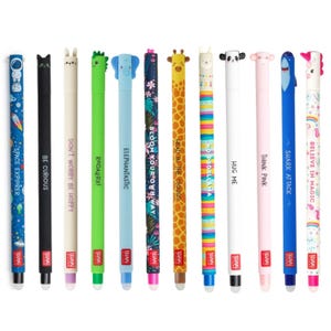 May include: A collection of colorful pens with various animal and space-themed designs. Each pen features a unique character or pattern, with phrases like "Space Explorer," "Be Curious," and "Shark Attack." The pens are made by Legami.
