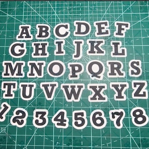 Lettres en papier cartonné | Stickers Lei supplémentaires | Stickers noirs et blancs |