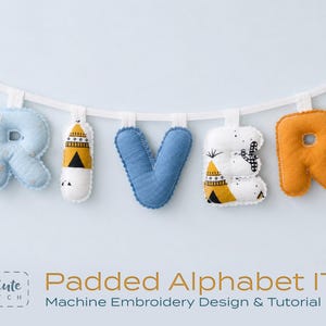May include: A fabric banner spelling the name RIVER with padded, stuffed letters attached to a white ribbon. The letters feature light blue, mustard yellow, and white fabric with patterns including stars, teepees, and cacti. Text reads So Cute Stitch Padded Alphabet ITH Machine Embroidery Design & Tutorial PDF.