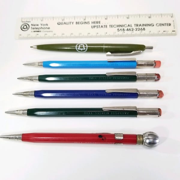 Collection of vintage Bell Systems mechanical pencils plus olive green pen, 6 total