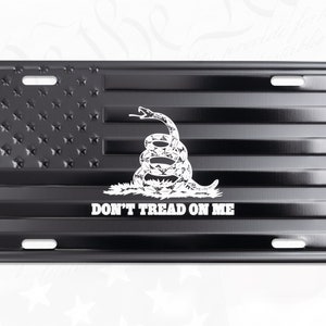 Gadsden Don&#39;t Tread On Me License Plate Tag on Embossed American Flag.