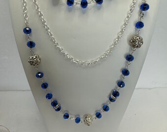 Three stranded blue bead and silver plated chain and beads