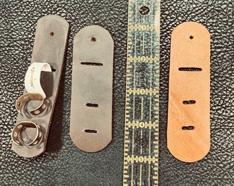 Leather slotted strap for finger picks