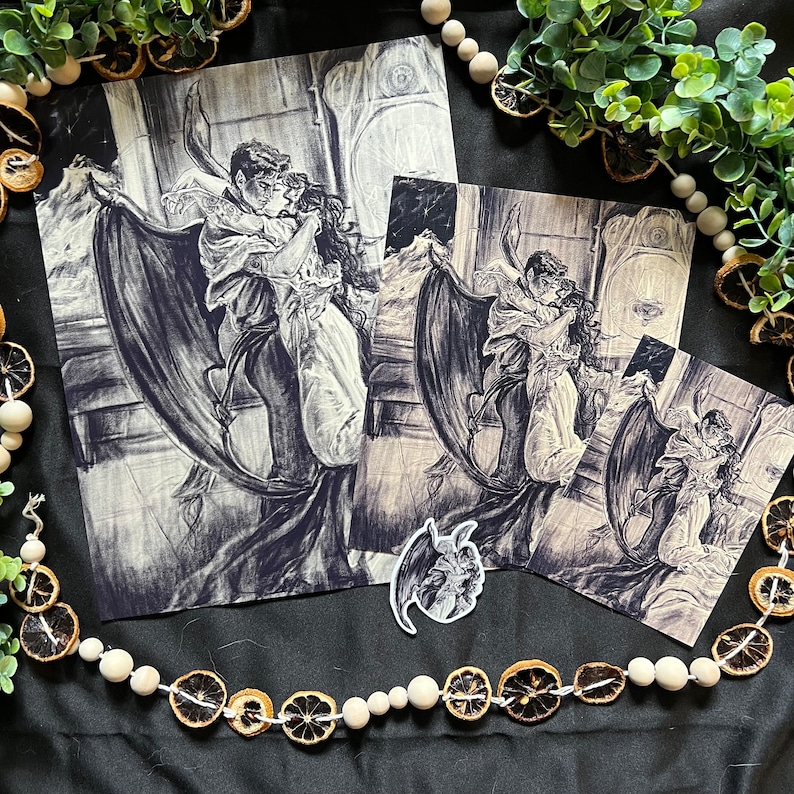 May include: A black and white illustration of a couple embracing with a large bat wing behind them. The couple is dressed in Victorian-era clothing. The illustration is drawn in a gothic style.